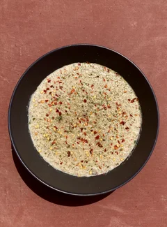 Creamy mushroom risotto topped with oregano and chilli flakes