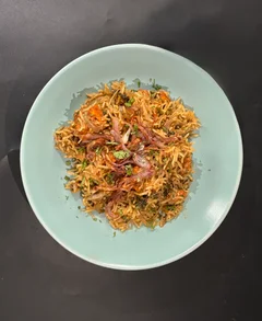 Crisp fried onions on top of the biryani